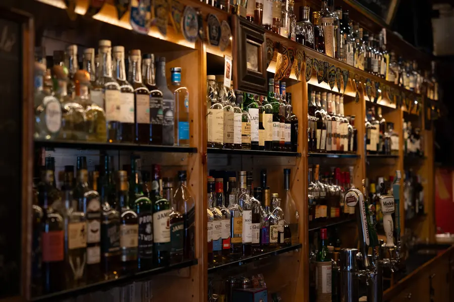 The back bar and whiskey selection at Macabi