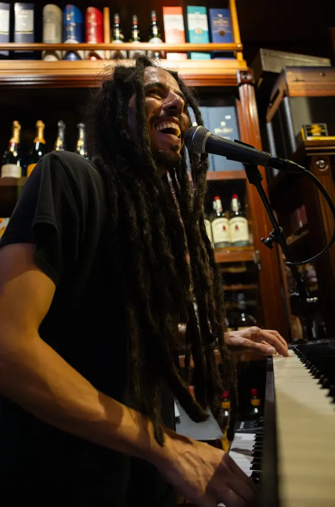 A guest enjoying live music inside Macabi